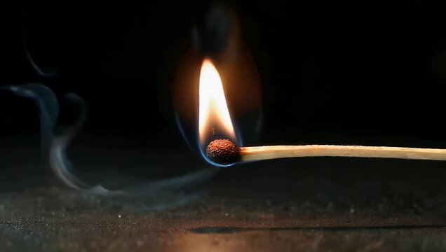 4K close up of burning match against truly black background perfect OLED displays highlighting flame motion color contrast visual effects fire lighting stock 