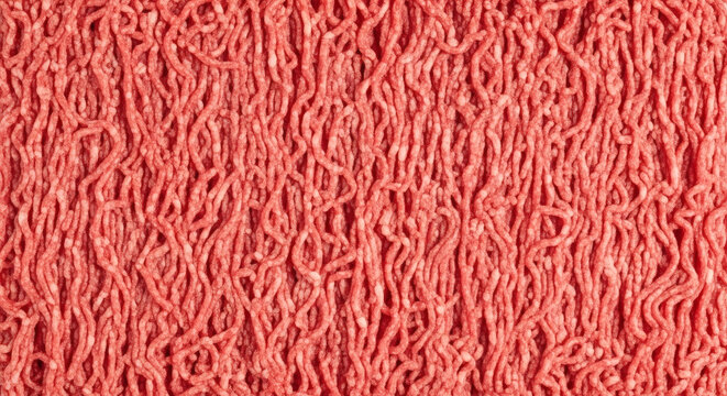 Ground beef texture background showing raw fresh red meat mince patterns for cooking recipes and culinary food industry projects