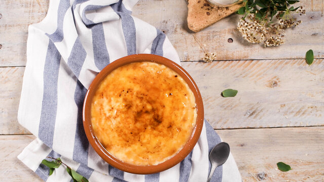Traditional Portuguese Rice Pudding in a Clay Bowl