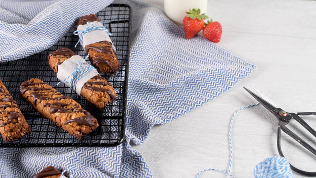 Homemade Granola Bars Drizzled with Dark Chocolate on a Wire Rack