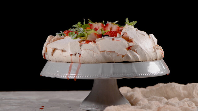 Pavlova Cake with Fresh Berries and Mint on a Pedestal Stand