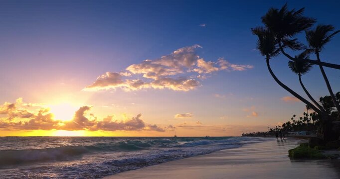 Tropical Island Beach Sunrise with Palm trees and Ocean Waves Dominican Republic, Caribbean sea