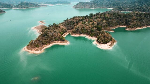 Khao sok lake displaying numerous lush green tropical islands and turquoise water
