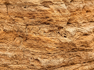 Naklejka premium sandstone texture background, natural layered surface, warm tan orange tone, organic rustic feel, high resolution macro detail, commercial stock photo