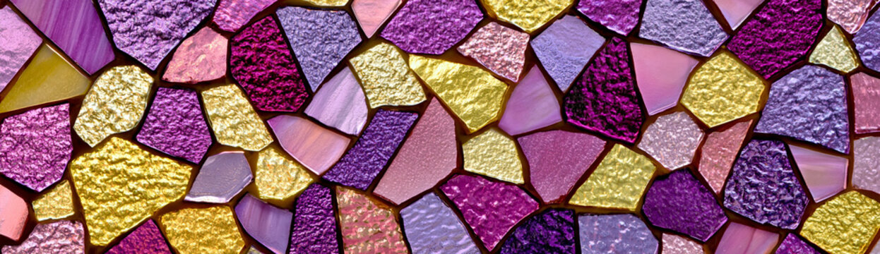 Closeup of mosaic stained glass with abstract geometric pattern in shades of purple, magenta, pink and gold, rough textured glass fragments, decorative panoramic background.