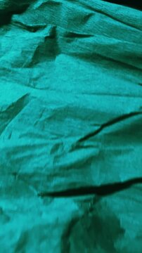 Vertical blue-green abstract texture motion, perfect for web design, social media, tech branding, and modern advertising visuals.