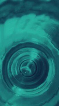 Modern background video in greenish tones. Light reflections in circular motion. Ideal for social media, tech brands, and modern advertising visuals.Space for text.