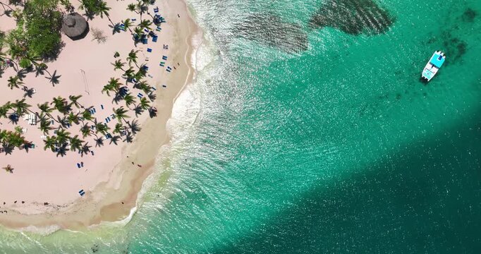 Aerial View of Tropical Island in the Ocean, Exotic Beach With Palm Trees, Turquoise Water, White Sand and Catamaran Yacht Boat Near Shore