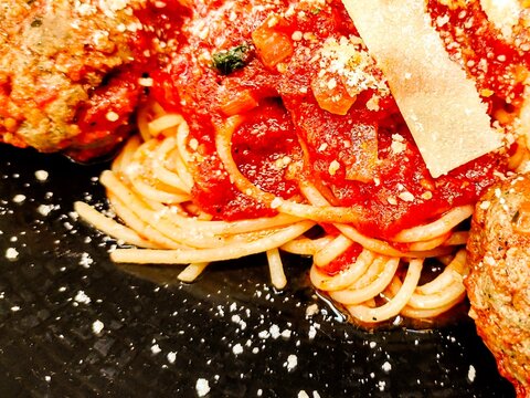Close-up of a plate of Spaghetti and Meatballs with Parmesan Cheese
