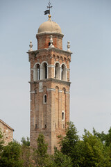 Obraz premium Exterior view of a church and belltower on Burano island in the Venetian Lagoon