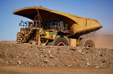 Kalgoorlie gold mining Western Australia mining a large yellow mining dump truck in open pit mine haulage © electra kay-smith