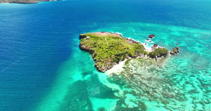 Wild tropical Island in the ocean aerial top down view