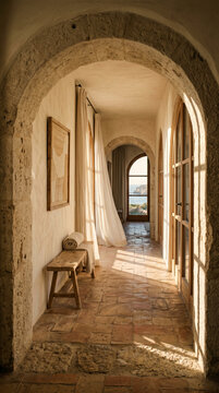 Minimalist Mediterranean corridor with stone arch and wooden bench &mdash; luxury villa interior background with blowing linen curtain and sea view window