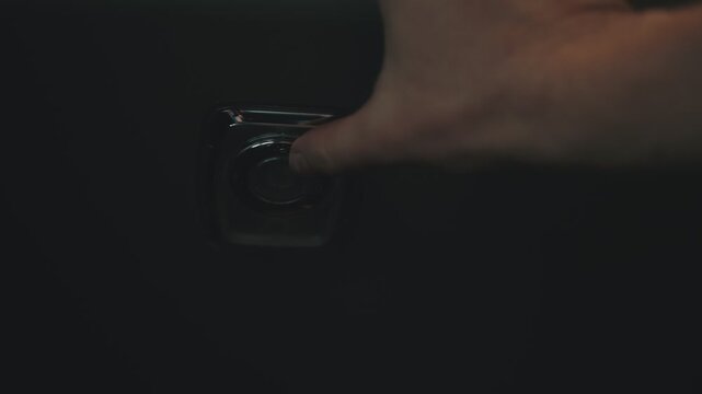 Hand turning on and off interior dome light
