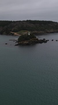 White Lighthouse In Coastline