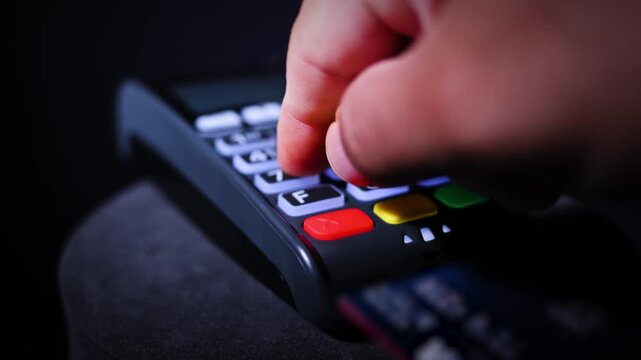 Hand Entering Pin Code On Credit Card Payment Terminal Keypad 
