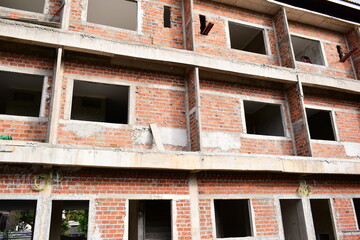 Obraz premium exterior view of brick house under construction with concrete structure