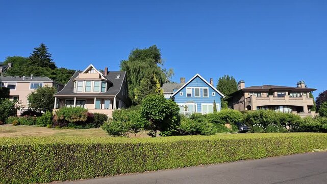 Panning shot of residential houses on a hillside in Washington state