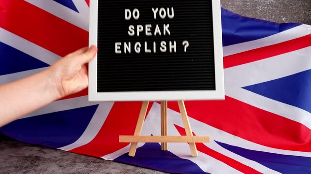 Message DO YOU SPEAK ENGLISH on background of Great Britain UK flag. British national flag with concept of High school university college education, language courses, online distance learning