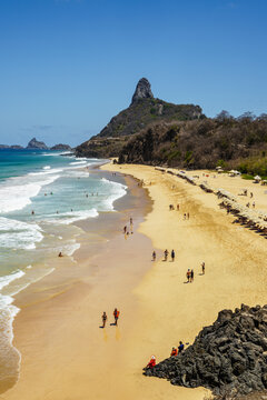 Elevated view of a beach with Morro do Pico and tourists, Fernando de Noronha, Pernambuco, Brazil