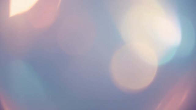 Soft pastel light bokeh circles moving slowly in a dreamy abstract digital motion video clip background