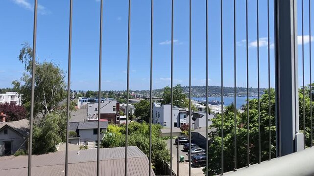 View of Seattle waterfront and residential neighborhood from balcony