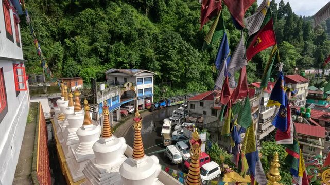 Darjeeling in West Bengal, India. A top view of the toy train and the town on a rainy morning.