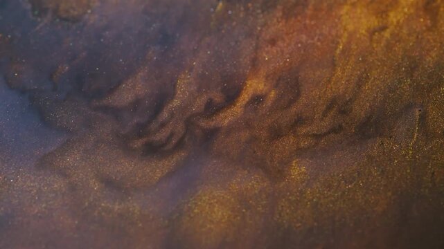 Pigment spill. Color stream. Defocused yellow blue neon bright paint liquid particles sparkling splash floating on abstract background.