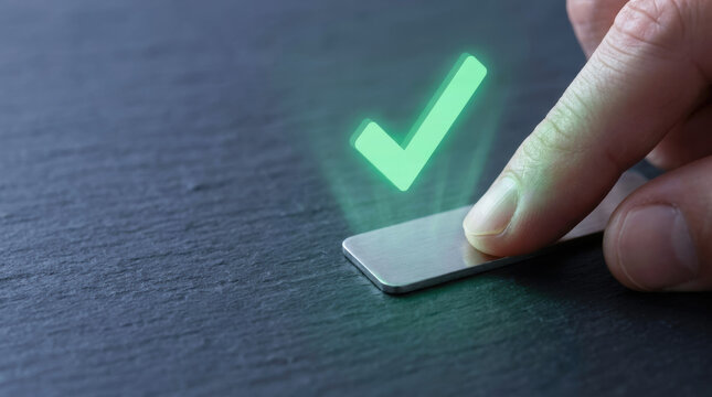 Finger pressing metallic button with glowing check mark symbol representing customer value proposition and cvp for business success and trust