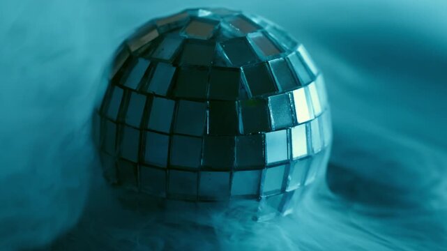 Glow disco ball. Blue cloud steam. Defocused cold color splash gleam round texture glass smoke cascade on abstract art light background.