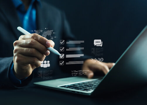 Business professional using digital checklist on laptop for online survey, customer feedback, quality assurance, compliance audit, task management, and workflow optimization in modern digital office.