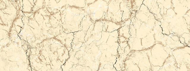 Fototapeta premium Wide textured background with a cracked beige surface. Marble slab texture. Abstract grunge surface with many chaotic white cracks.