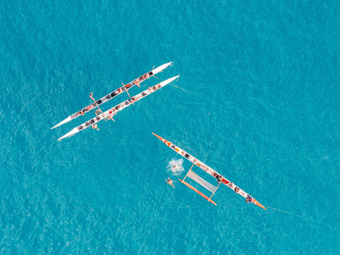 Aerial top view of outrigger canoes in turquoise water, Fernando de Noronha, Pernambuco, Brazil