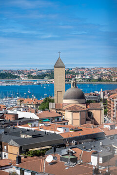Gij&oacute;n waterfront cityscape with san pedro church and marina