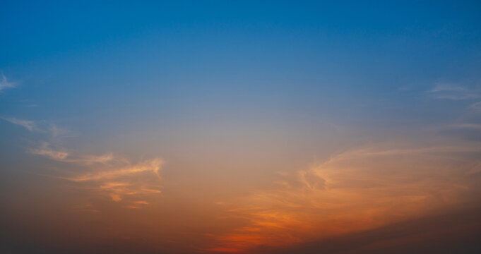 Colorful sunset sky with soft clouds and warm gradient tones for natural backgrounds