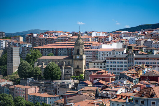 Eibar city overview showing rooftops and church clock tower