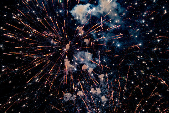 exploding fireworks and smoke in dark night background