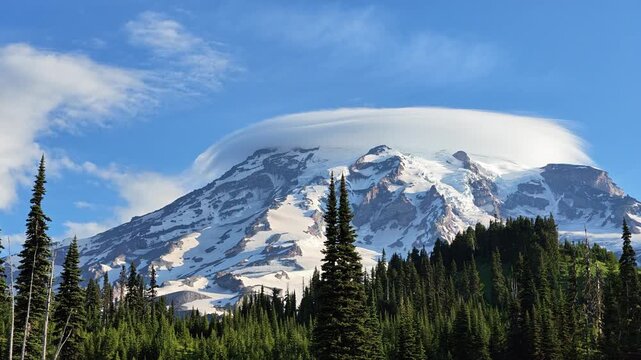 Mount Rainier with lenticular cloud and pine forest