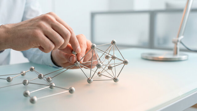 Systems Thinking Concept with Hand Adjusting Connected Node Framework