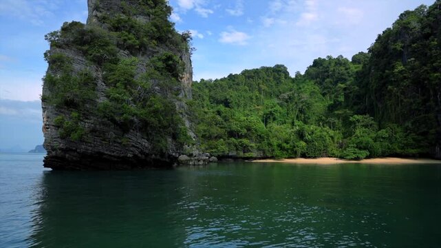 serene natural beauty of lush green cliffs and water in a fixed perspective showing cliffs and water in a natural landscape with rock and vegetation, travel and nature context.