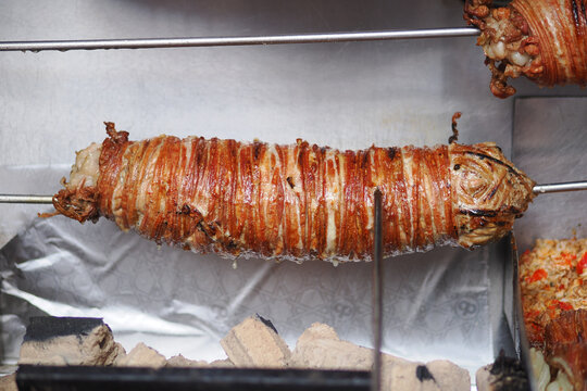 kokoretsi a popular street food made from lamb or goat intestines wrapped around seasoned offa