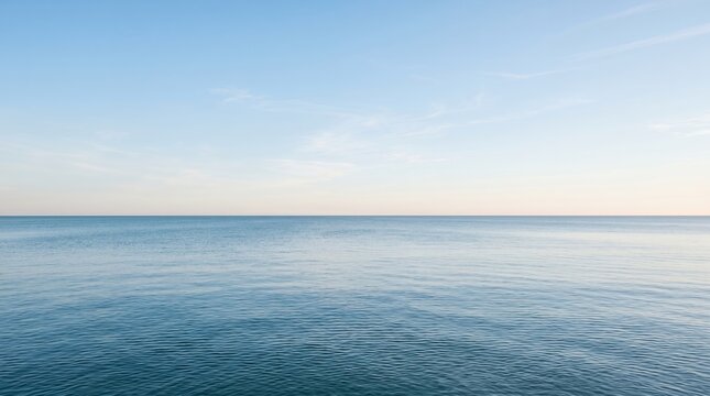 Vast Ocean Horizon Under a Clear Blue Sky.
