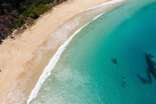 Aerial view of a crescent beach with turquoise water, Fernando de Noronha, Pernambuco, Brazil