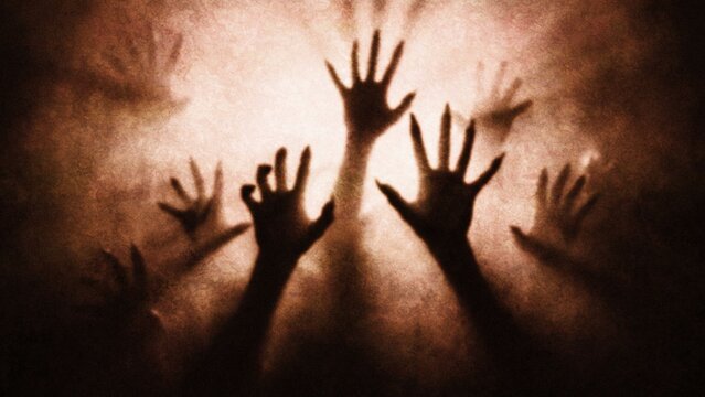 Halloween spectral hands emerging from smoky darkness during a spooky night with eerie atmosphere