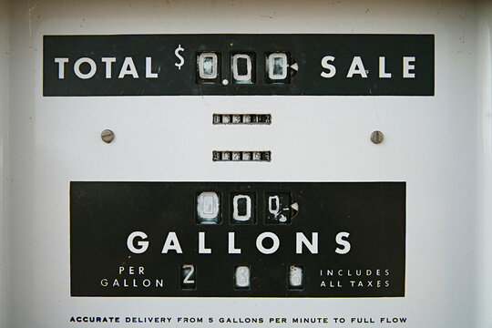 close up of old sign petrol pump with the price of fuel per gallon
