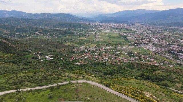 Drone Pull Back From Winding Road Above Elbasan Albania
