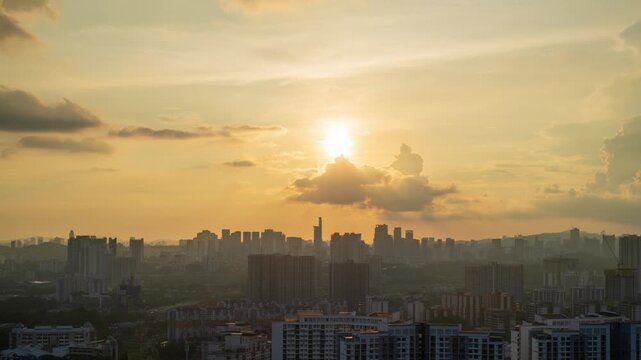 Aerial birds eye view of dramatic sunset time lapse behind Menara Telekom in Petaling Jaya, Kuala Lumpur