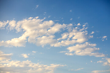 Obraz premium Blue Sky With Soft White Fluffy Clouds on a Bright Clear Day
