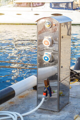 Fototapeta premium Stainless Steel Shore Power Pillar on a Yacht Marina Dock