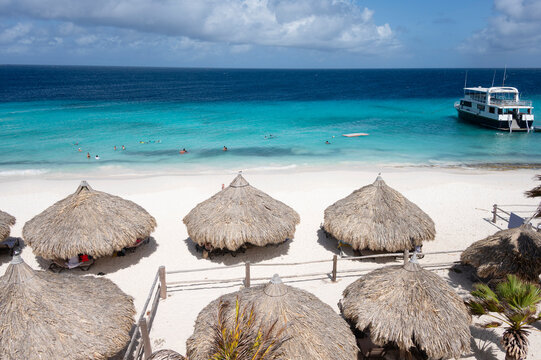 Klein Cura&ccedil;ao island beach with palapas and clear turquoise water
